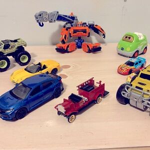 Kids’ toy trucks / cars, one transformer ; handheld.